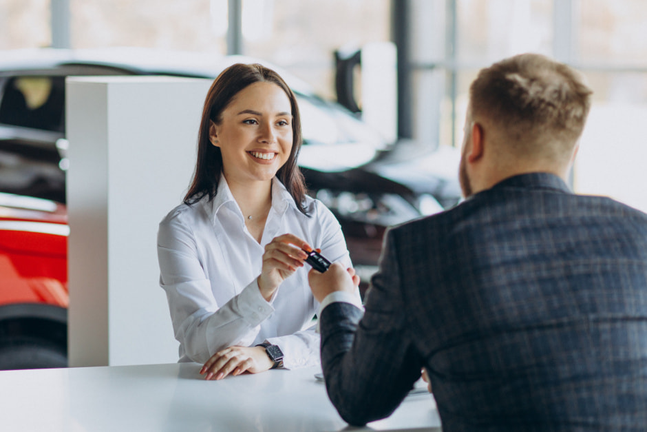 man-with-sales-woman-car-showroom.jpg