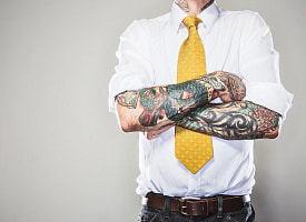 На жителя Могилева завели уголовное дело из-за татуировок. Как наказали?